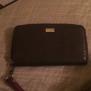 Gray wallet with purple strap